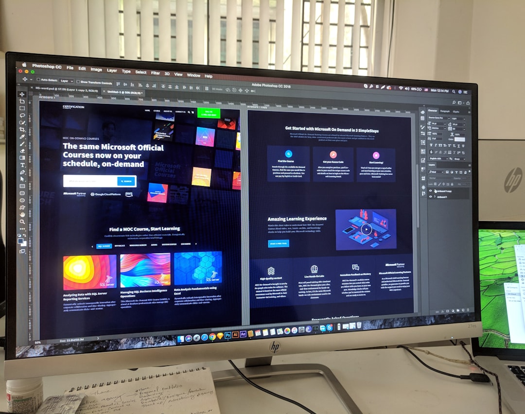 A dark computer monitor with a design interface