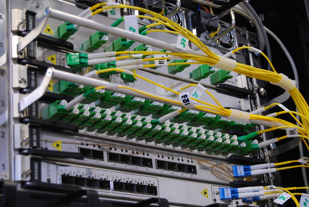 Fiber optic cables connected to a network switch in a server rack