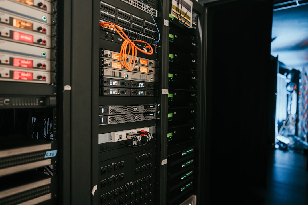 A rack of home servers with networking cables in a server room